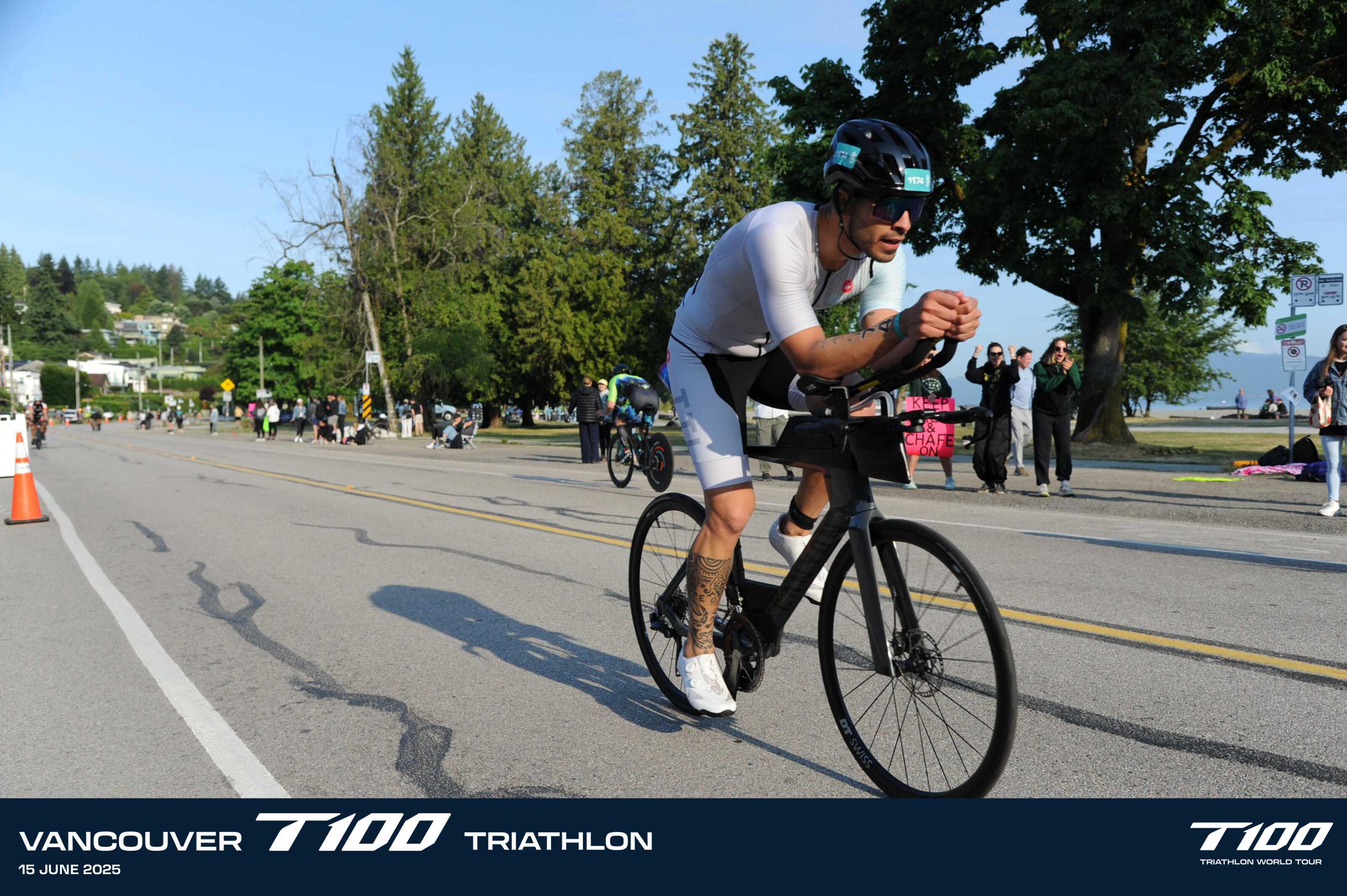 Lucas Calegari on his Canyon Speedmax CF 7 Di2 in TTL kit, deep in aero position on the T100 Vancouver 2025 bike course with crowd watching