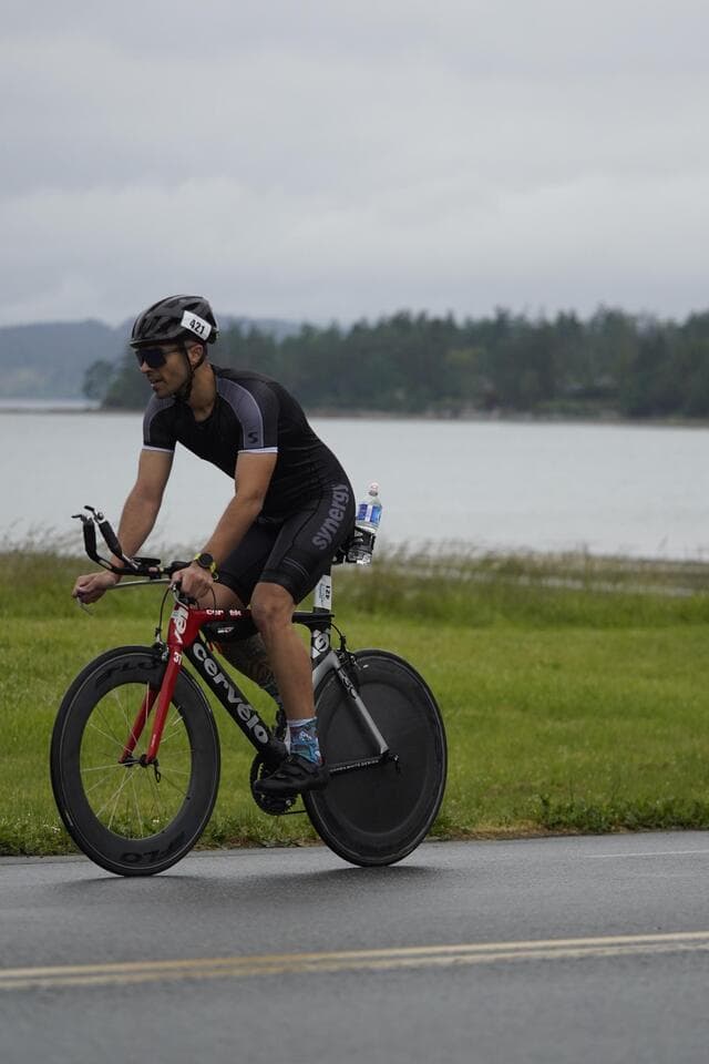 Lucas Calegari on his Cervelo TT bike with disc wheel at Ironman 70.3 Victoria 2024, race number 421