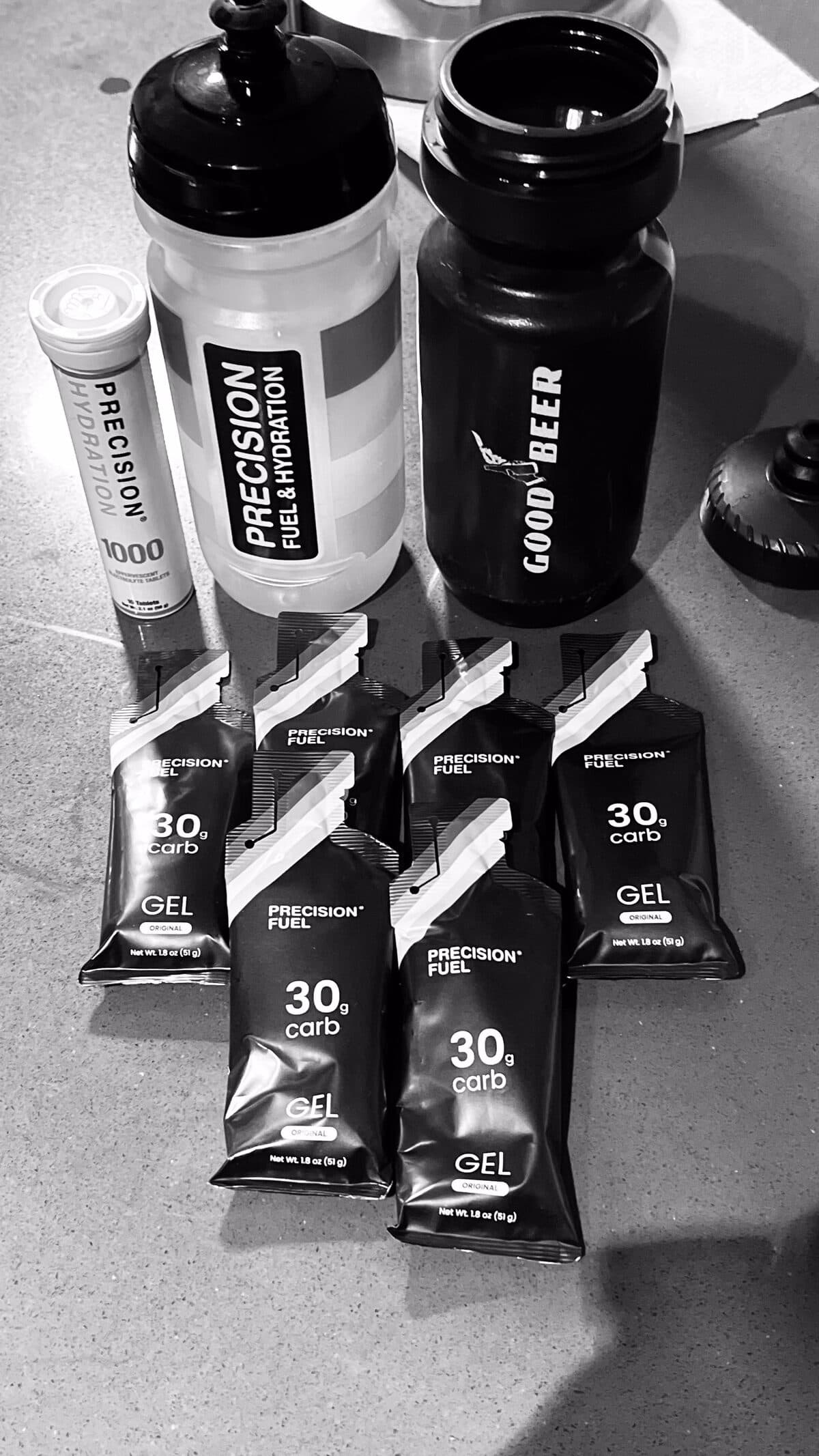 Six Precision PF 30 gels and a Precision electrolyte tube laid out before a long bike ride